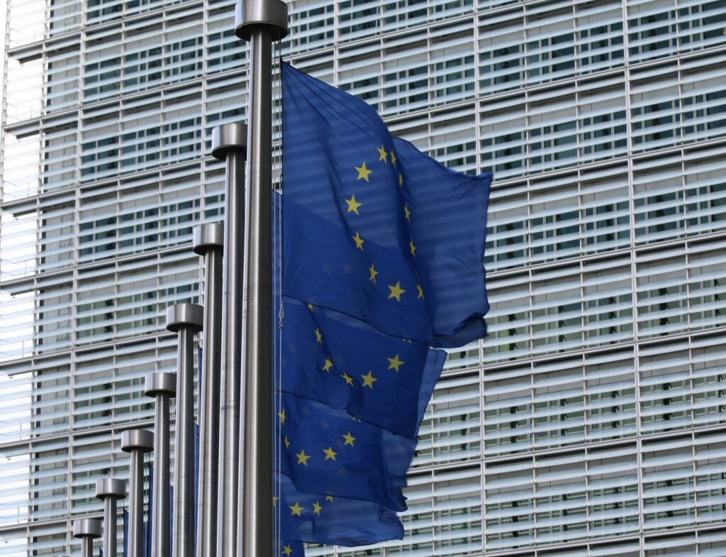 Photo of EU flags as EU-funded initiative CERTAIN aims to drive ethical AI compliance in Europe amid increasing regulations like the EU AI Act.