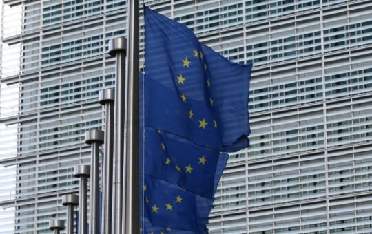 Photo of EU flags as EU-funded initiative CERTAIN aims to drive ethical AI compliance in Europe amid increasing regulations like the EU AI Act.