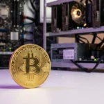 Bitcoin coin with mining hardware in studio lighting with purple gradient accents